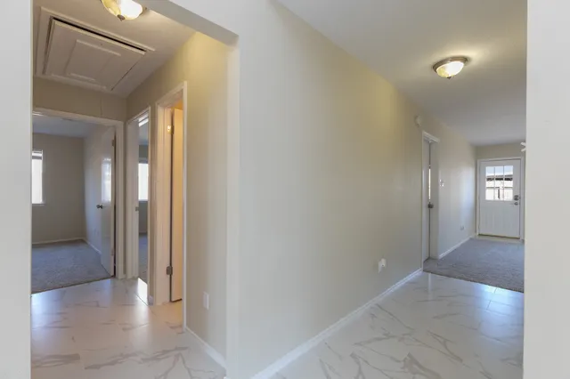 a white bath tub sitting next to a white sink