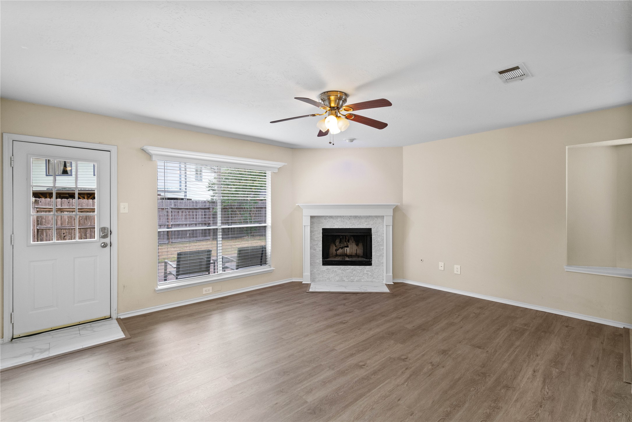 3422 Keygate Drive Spring, TX 77388 - Photo 21 of 32 a view of an empty room with a fireplace and a window