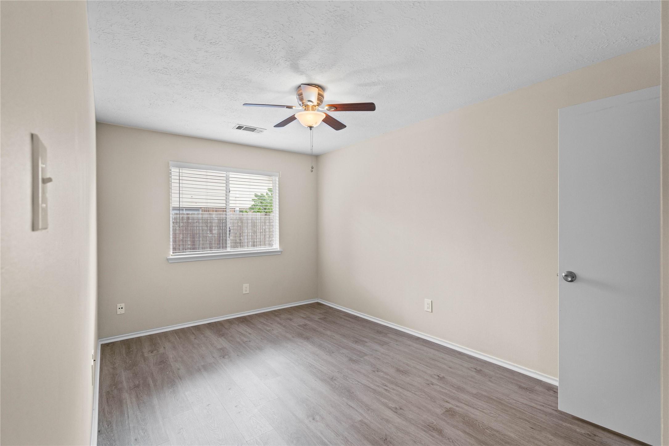 3422 Keygate Drive Spring, TX 77388 - Photo 24 of 32 wooden floor in an empty room with a window