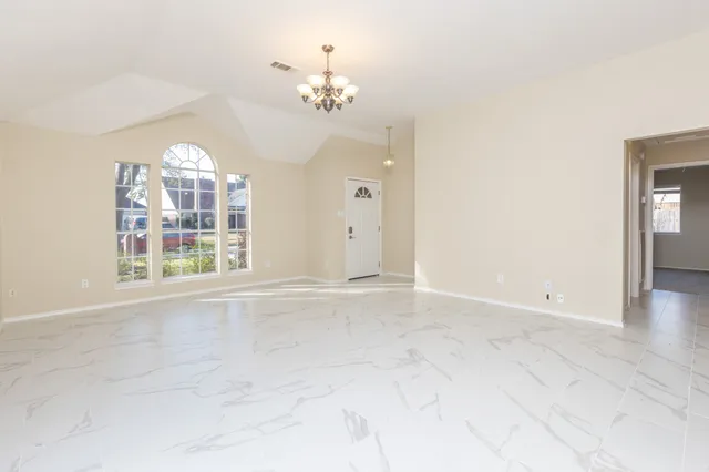 a view of an empty room with a window