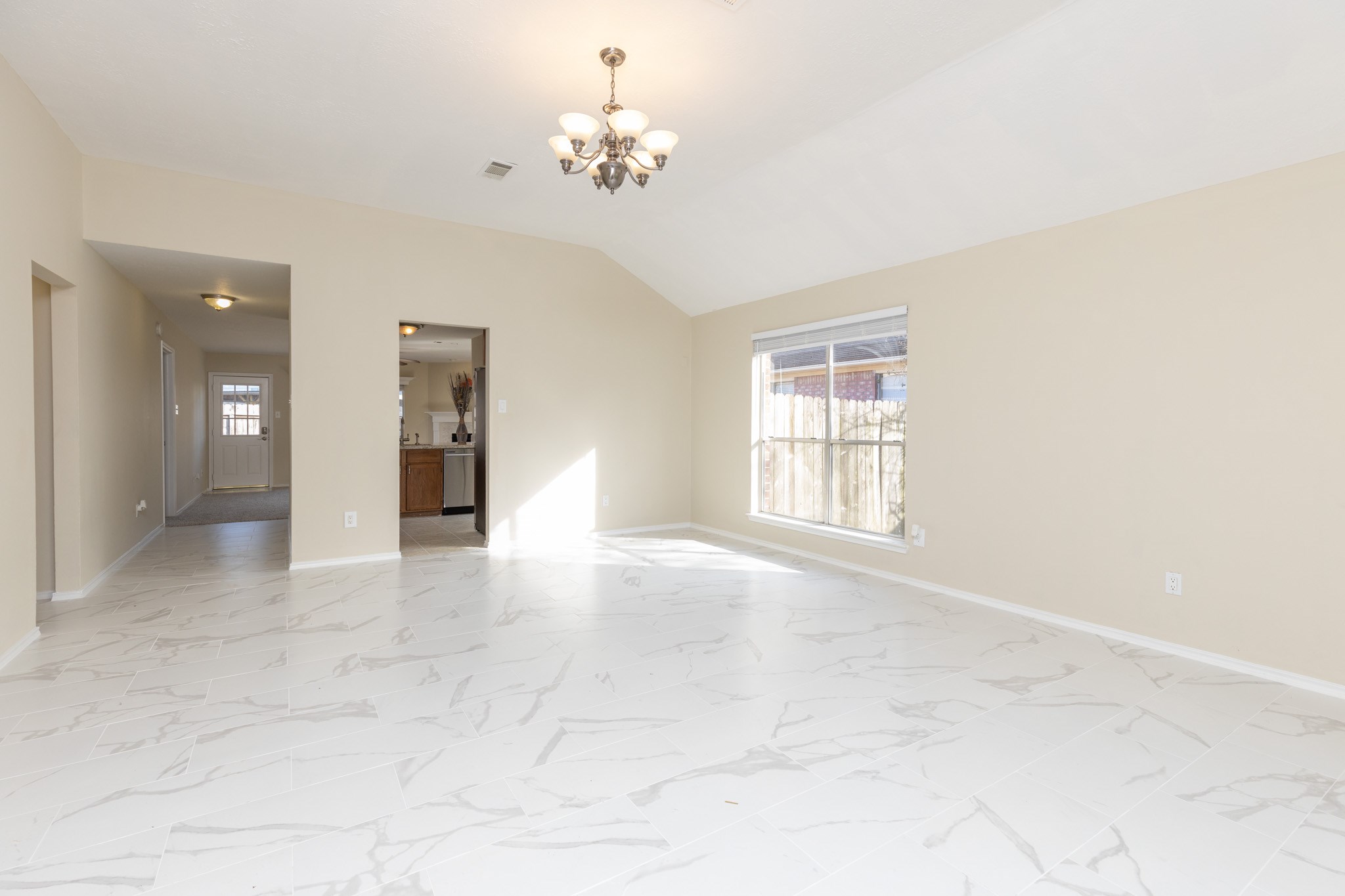 3422 Keygate Drive Spring, TX 77388 - Photo 5 of 32 en empty room with windows and chandelier