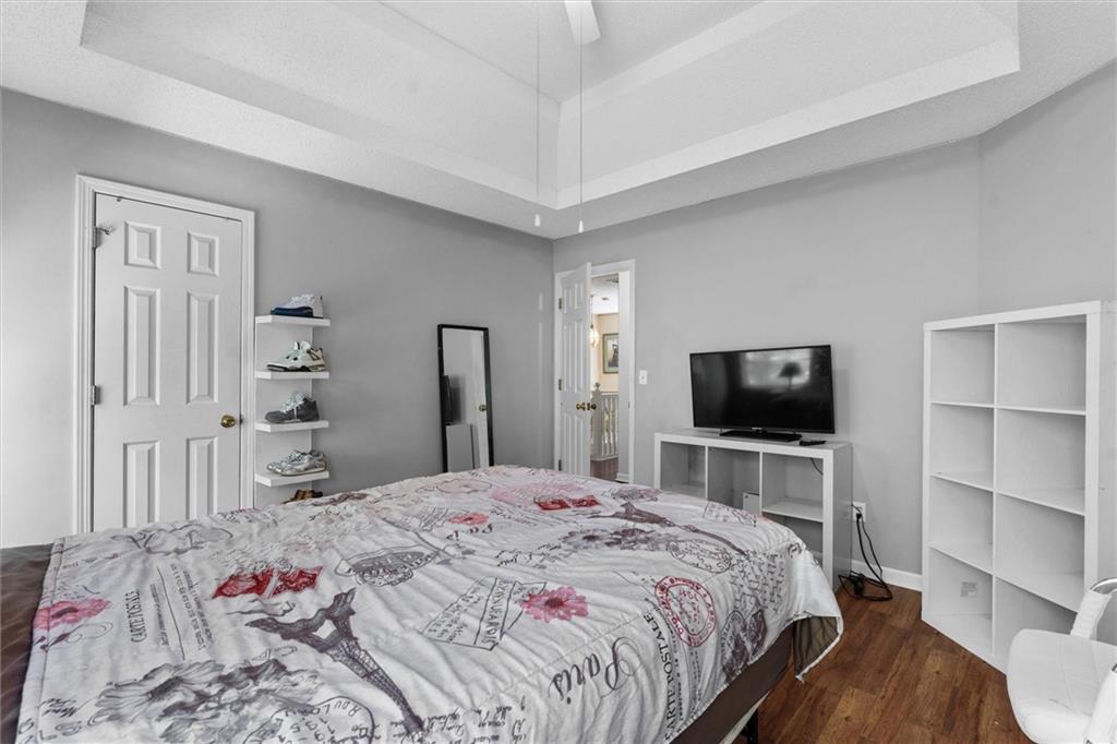 3234 Mineral Ridge Lane Stone Mountain, GA 30087 - Photo 33 of 55 a bedroom with a bed and a flat screen tv