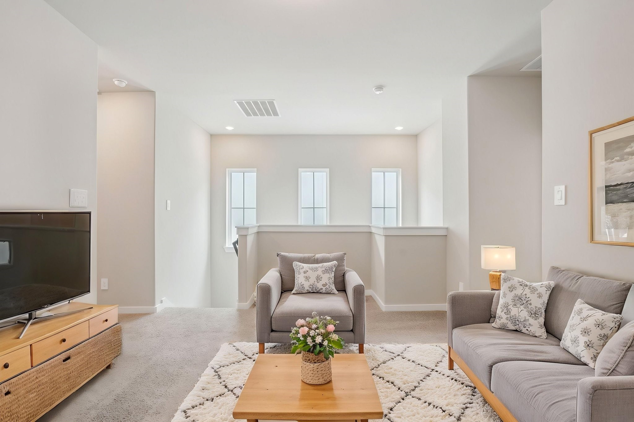 3119 Quiet Sunset Drive Houston, TX 77080 - Photo 20 of 46 a living room with furniture and a flat screen tv