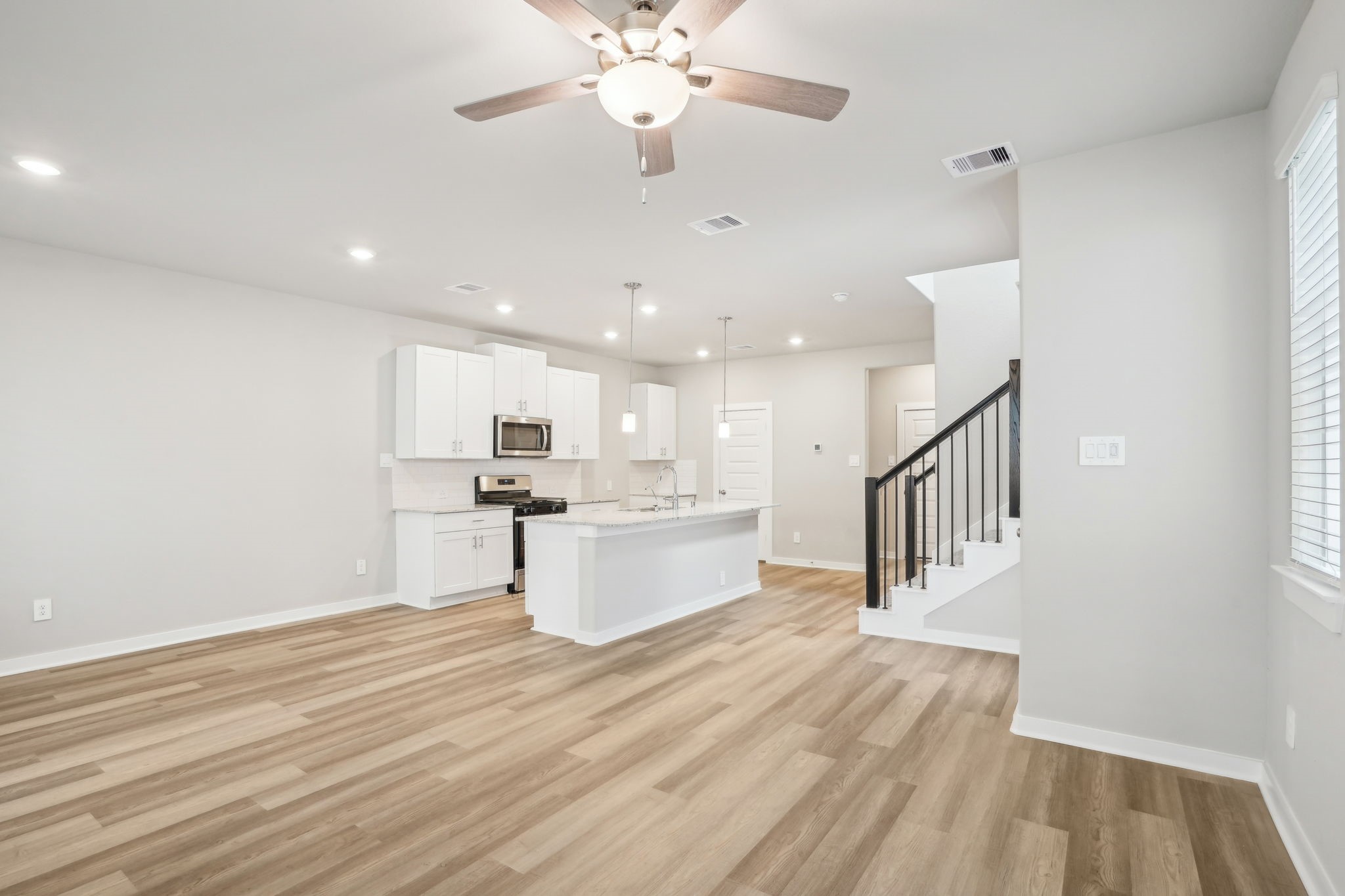 3119 Quiet Sunset Drive Houston, TX 77080 - Photo 2 of 46 a view of kitchen with sink and wooden floor