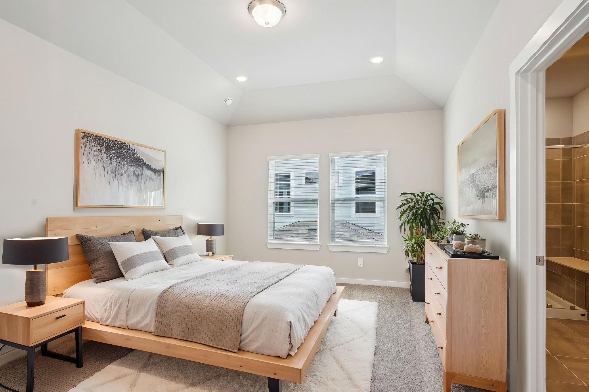 3119 Quiet Sunset Drive Houston, TX 77080 - Photo 24 of 46 a spacious bedroom with a large bed and a potted plant