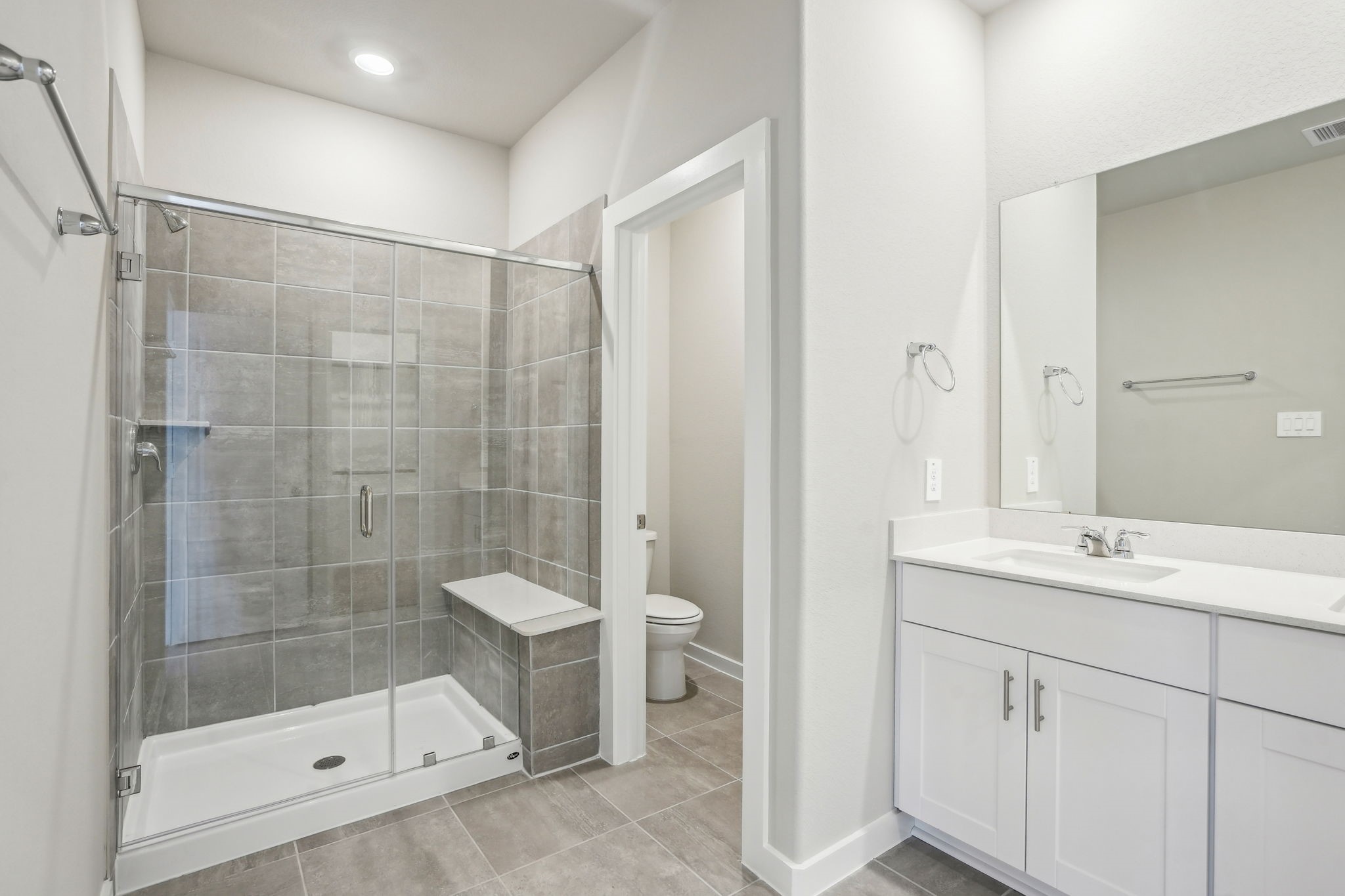 3119 Quiet Sunset Drive Houston, TX 77080 - Photo 26 of 46 a bathroom with a shower sink vanity and toilet