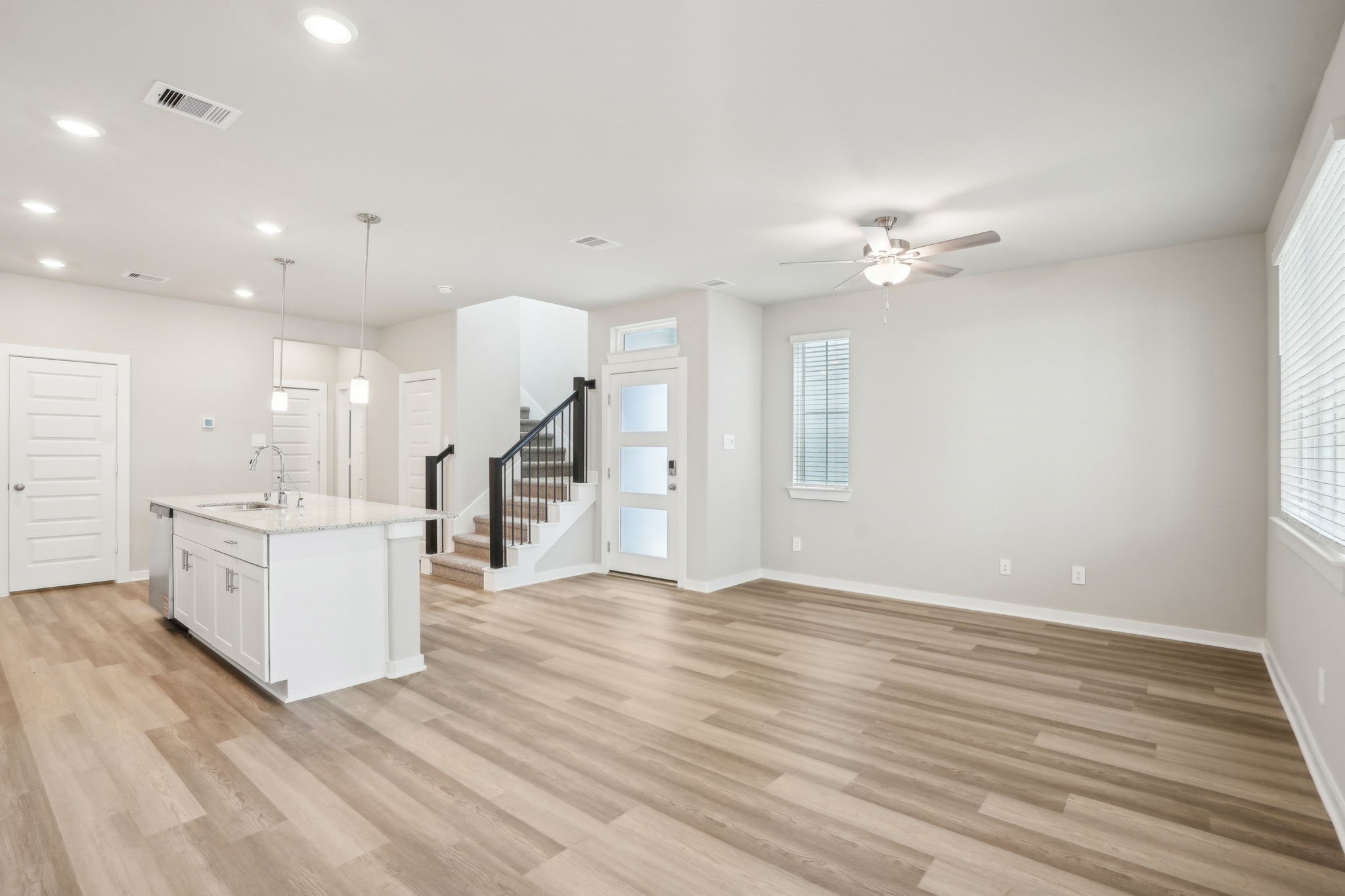 3119 Quiet Sunset Drive Houston, TX 77080 - Photo 9 of 46 a view of a kitchen with a sink cabinets and wooden floor