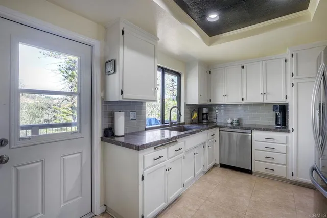 a room with table chairs and wooden floor