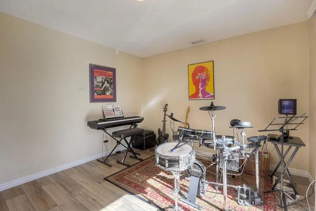 a spacious bedroom with a bed and a large window