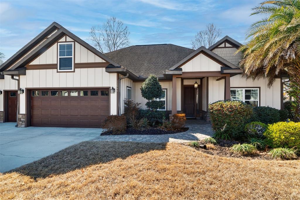 11949 Northwest 13 Road Gainesville, FL 32606 - Photo 1 of 46 a front view of a house with a yard and potted plants