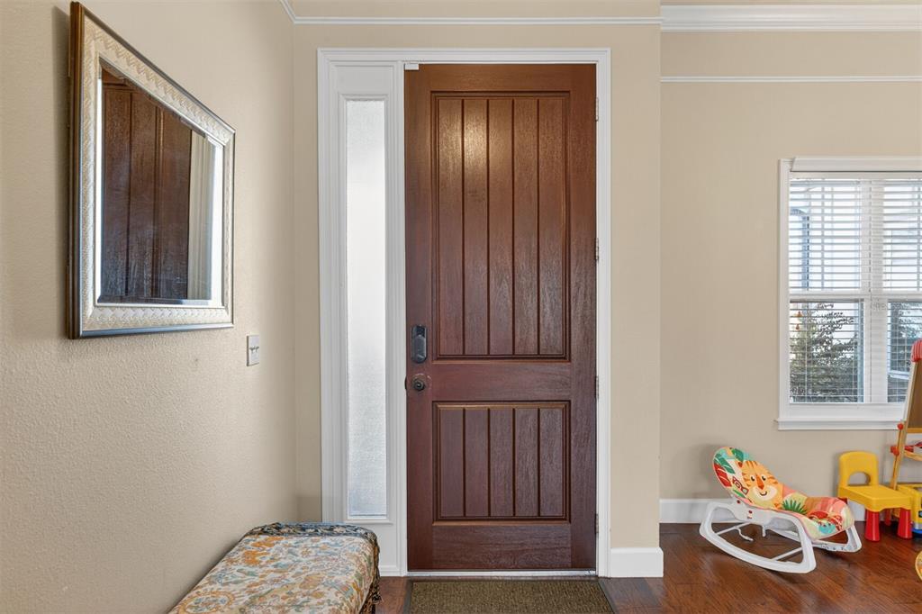 11949 Northwest 13 Road Gainesville, FL 32606 - Photo 17 of 46 a view of a bedroom with baby crib and toys