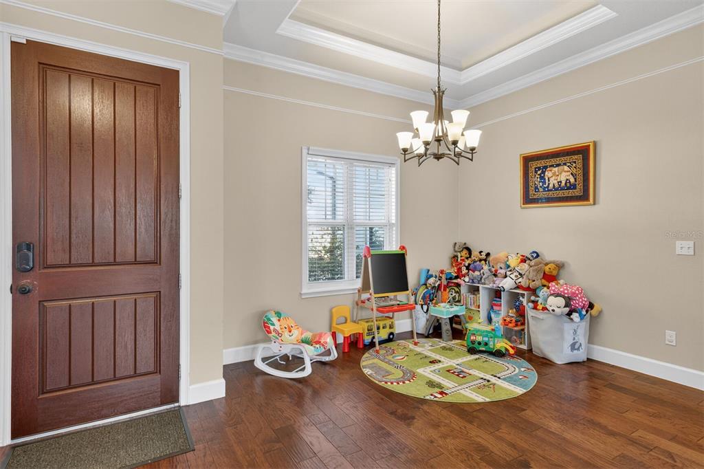 11949 Northwest 13 Road Gainesville, FL 32606 - Photo 18 of 46 a view of a dining room with furniture and chandelier