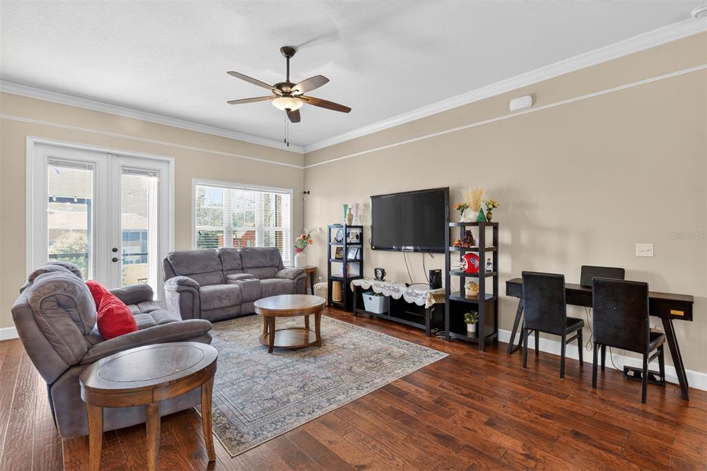 11949 Northwest 13 Road Gainesville, FL 32606 - Photo 21 of 46 a living room with furniture and a flat screen tv