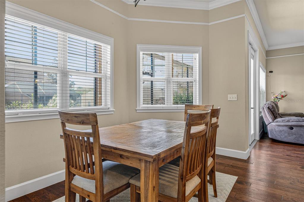 11949 Northwest 13 Road Gainesville, FL 32606 - Photo 25 of 46 a view of a dining room with furniture and wooden floor