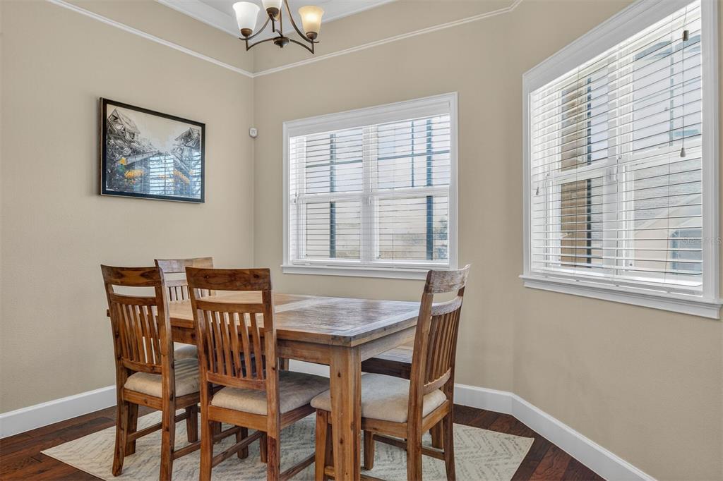 11949 Northwest 13 Road Gainesville, FL 32606 - Photo 26 of 46 a view of a dining room with furniture and a window