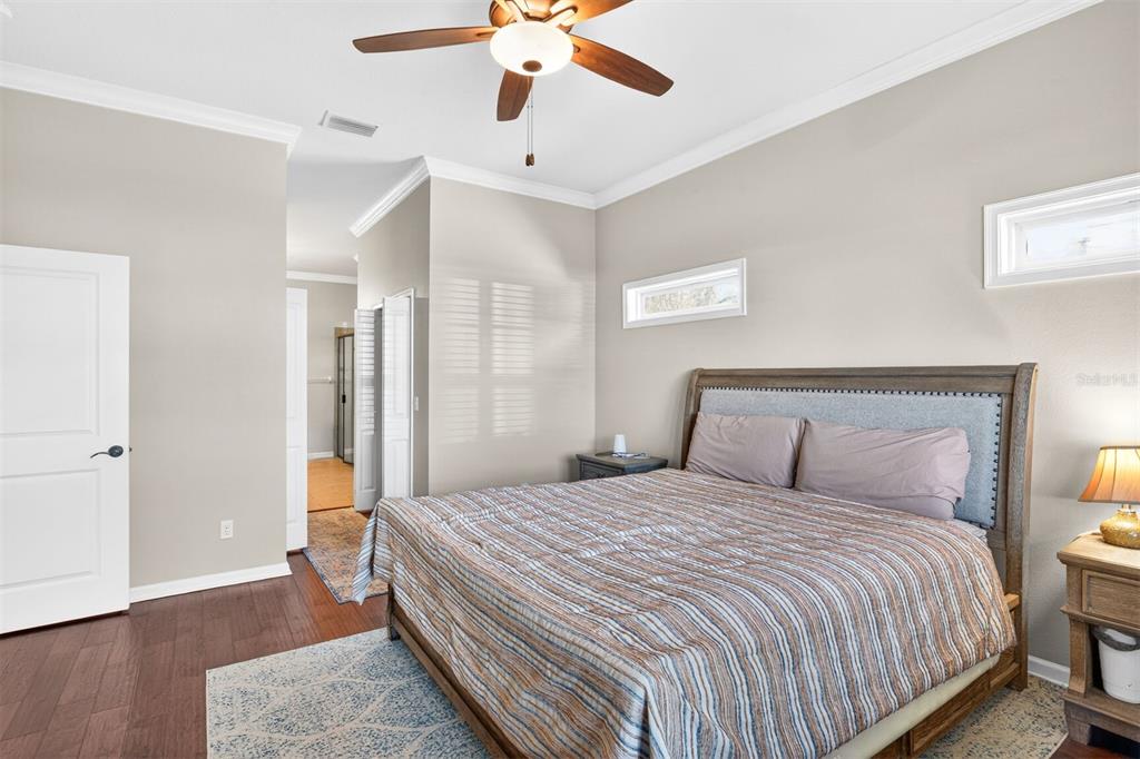 11949 Northwest 13 Road Gainesville, FL 32606 - Photo 28 of 46 a bedroom with a bed and a chandelier