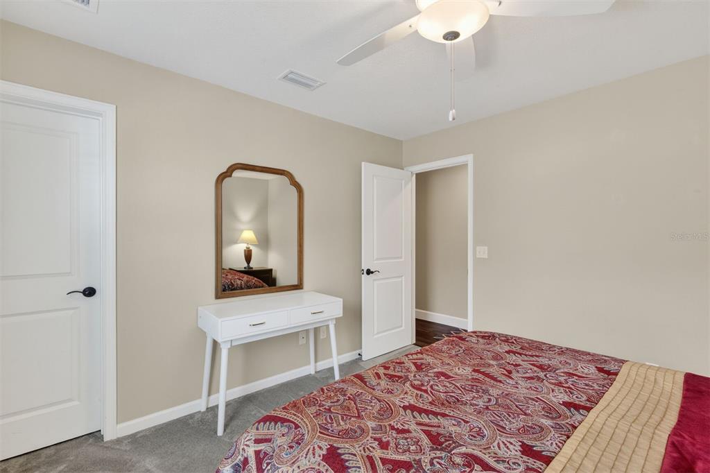 11949 Northwest 13 Road Gainesville, FL 32606 - Photo 37 of 46 a bedroom with a bed and a dresser