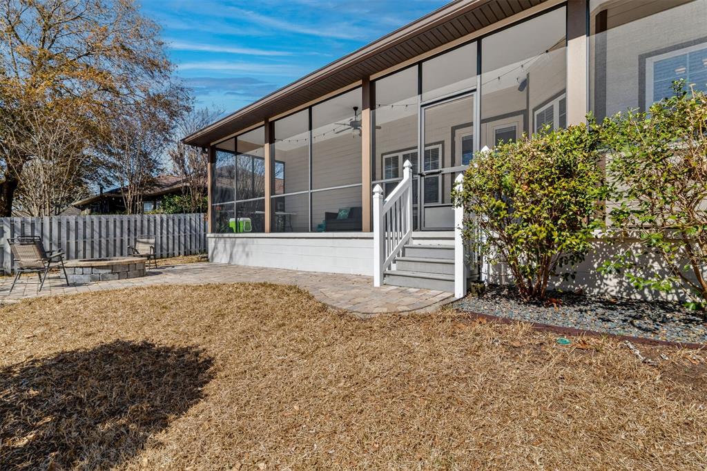 11949 Northwest 13 Road Gainesville, FL 32606 - Photo 44 of 46 a front view of a house with a yard