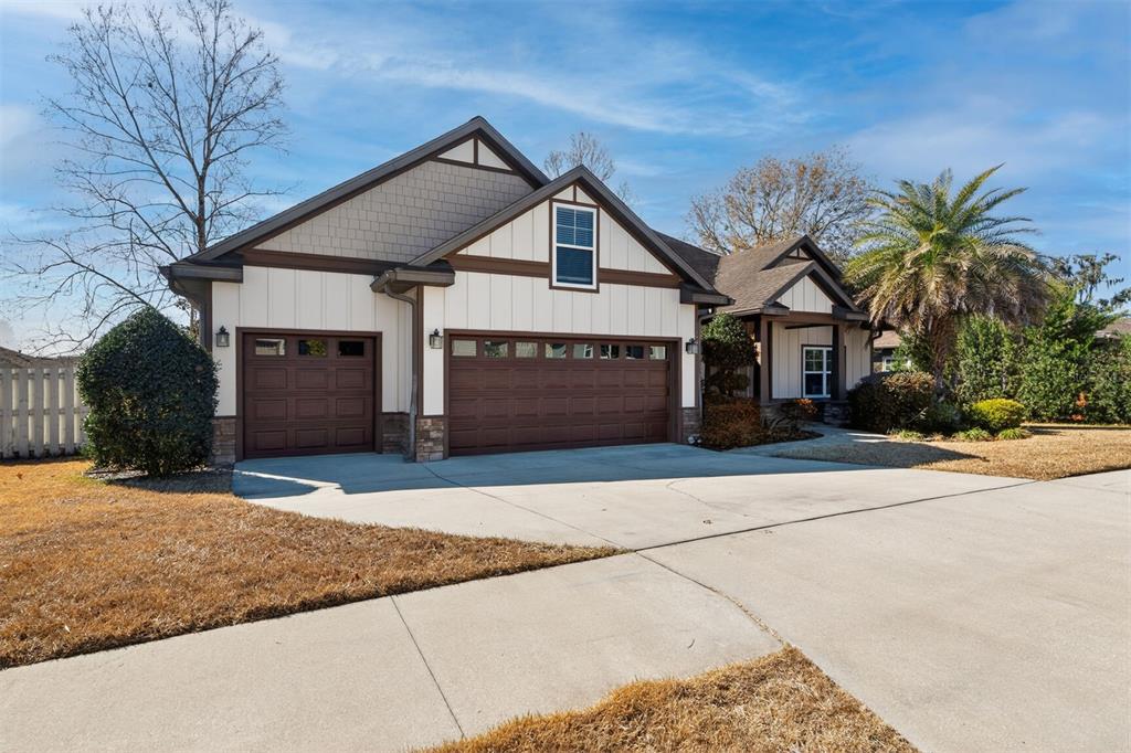11949 Northwest 13 Road Gainesville, FL 32606 - Photo 8 of 46 a front view of a house with a yard and garage
