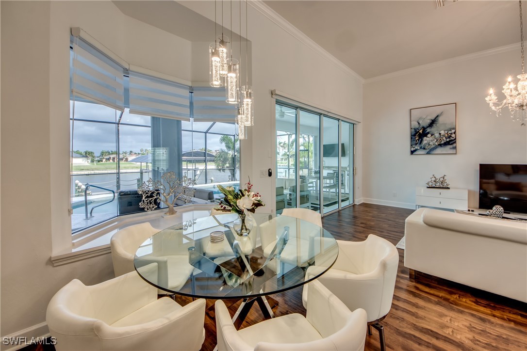 2703 Southwest 43rd Terrace Cape Coral, FL 33914 - Photo 11 of 50 a living room with furniture and a table