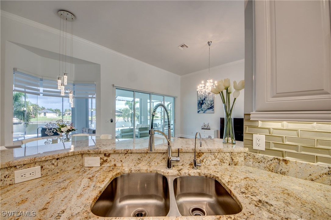 2703 Southwest 43rd Terrace Cape Coral, FL 33914 - Photo 14 of 50 a bathroom with double vanity sink and a bathtub