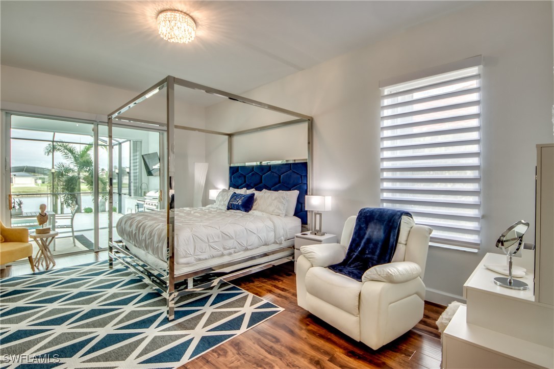 2703 Southwest 43rd Terrace Cape Coral, FL 33914 - Photo 19 of 50 a bed room with a bed and a couch