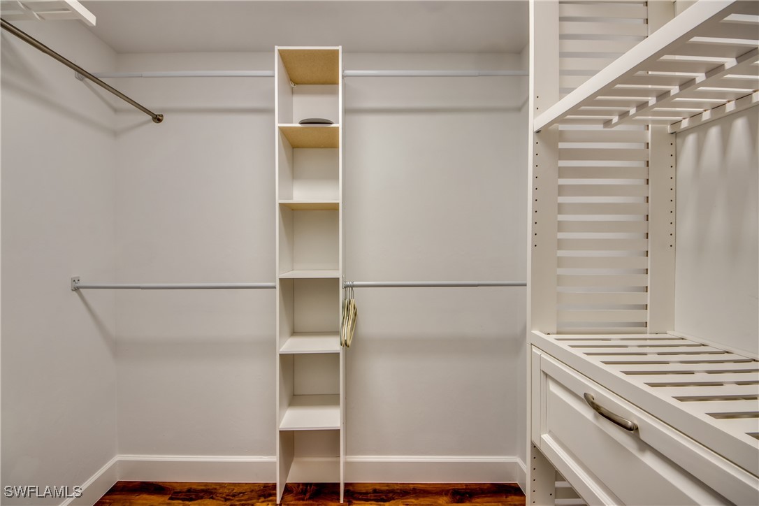 2703 Southwest 43rd Terrace Cape Coral, FL 33914 - Photo 21 of 50 a view of walk in closet with empty racks