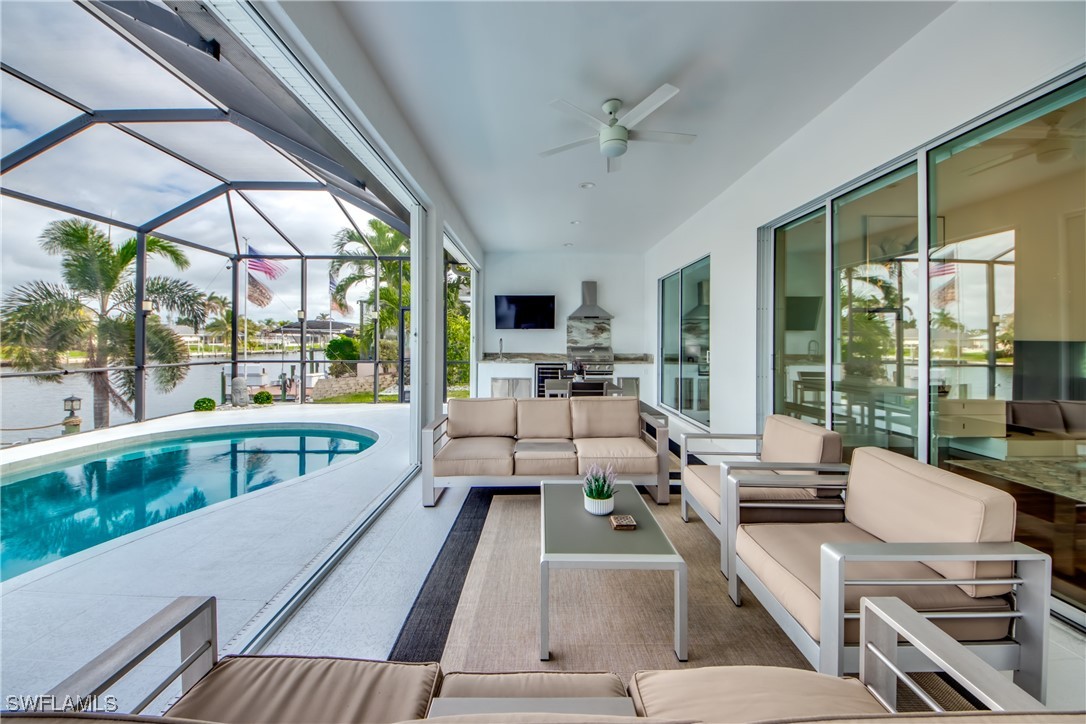2703 Southwest 43rd Terrace Cape Coral, FL 33914 - Photo 35 of 50 a view of a living room with furniture and large windows