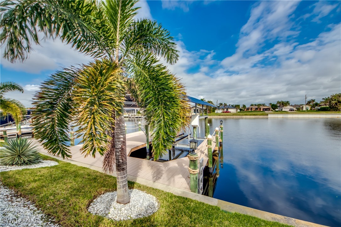 2703 Southwest 43rd Terrace Cape Coral, FL 33914 - Photo 41 of 50 a view of a lake with a yard