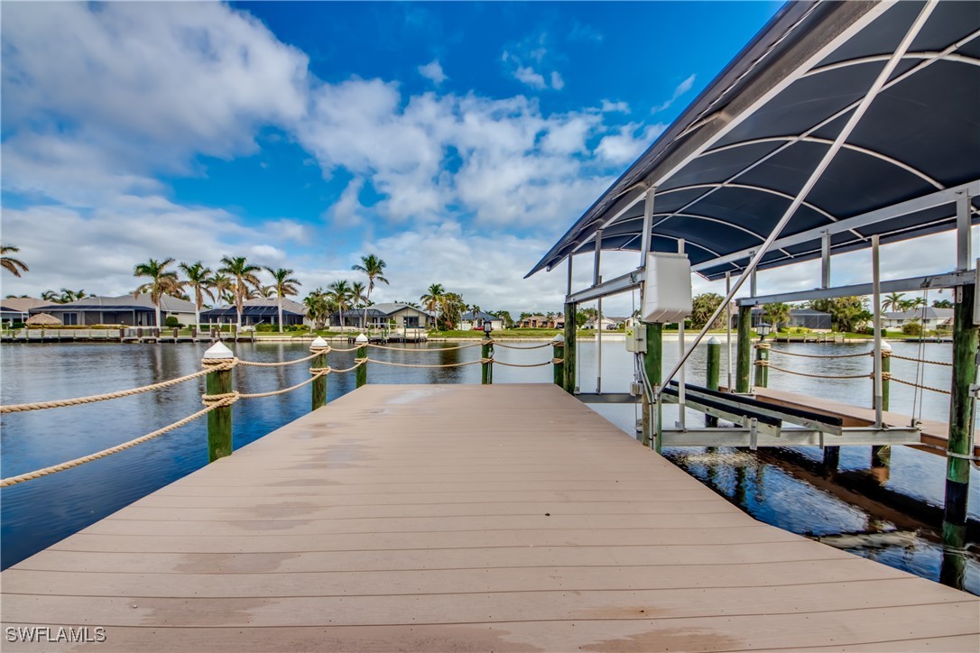 2703 Southwest 43rd Terrace Cape Coral, FL 33914 - Photo 43 of 50 a view of a swimming pool with a patio