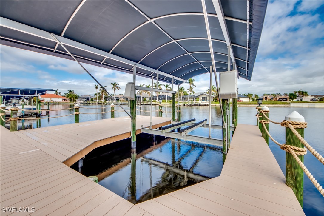 2703 Southwest 43rd Terrace Cape Coral, FL 33914 - Photo 44 of 50 a view of a swimming pool with a patio