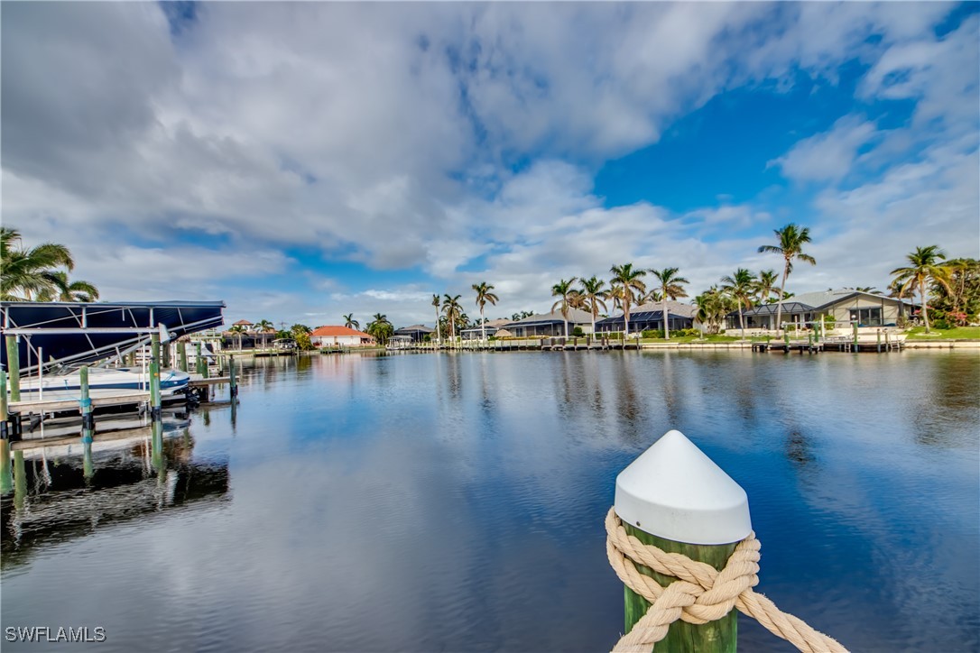 2703 Southwest 43rd Terrace Cape Coral, FL 33914 - Photo 48 of 50 a view of a lake with boats and trees in the background