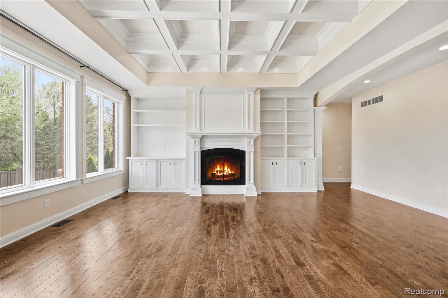 35339 West 13 Mile Road Farmington, MI 48331 - Photo 16 of 72 Great room with a fireplace and a coffered ceiling