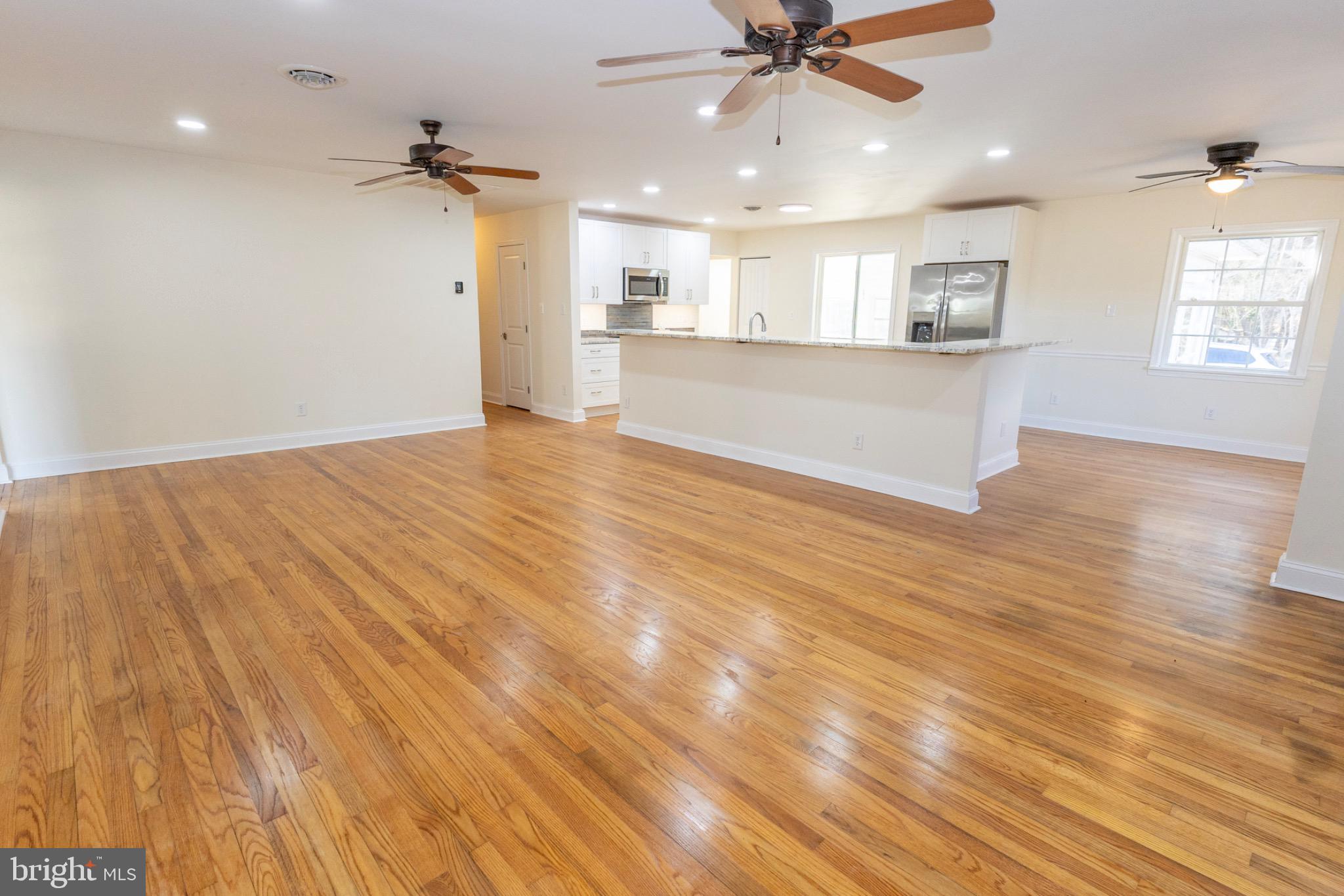 49151 Wynne Road Ridge, MD 20680 - Photo 31 of 80 Spacious, sunlit open-concept living area.