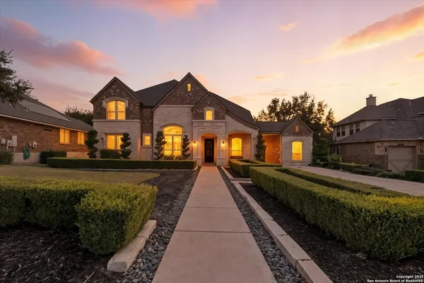 a front view of a house with a yard