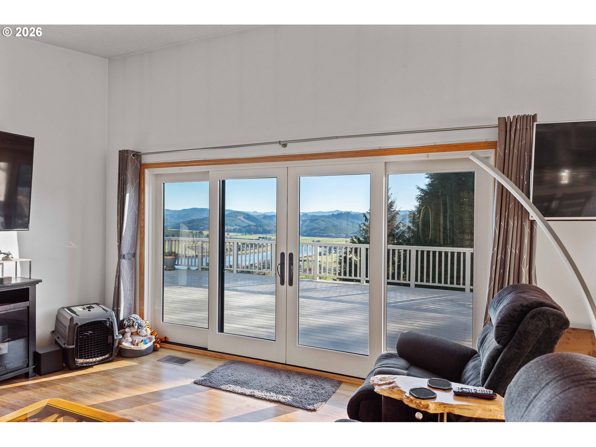 770 18th Avenue Coos Bay, OR 97420 - Photo 13 of 48 a living room with furniture lamp and floor to ceiling window