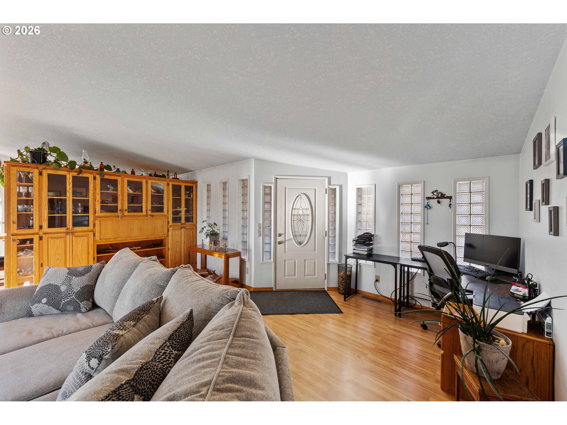 770 18th Avenue Coos Bay, OR 97420 - Photo 15 of 48 a living room with furniture and a flat screen tv
