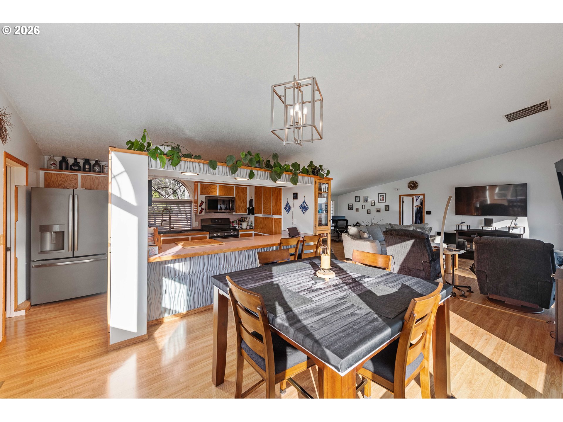 770 18th Avenue Coos Bay, OR 97420 - Photo 17 of 48 a view of a dining room with furniture a chandelier and wooden floor