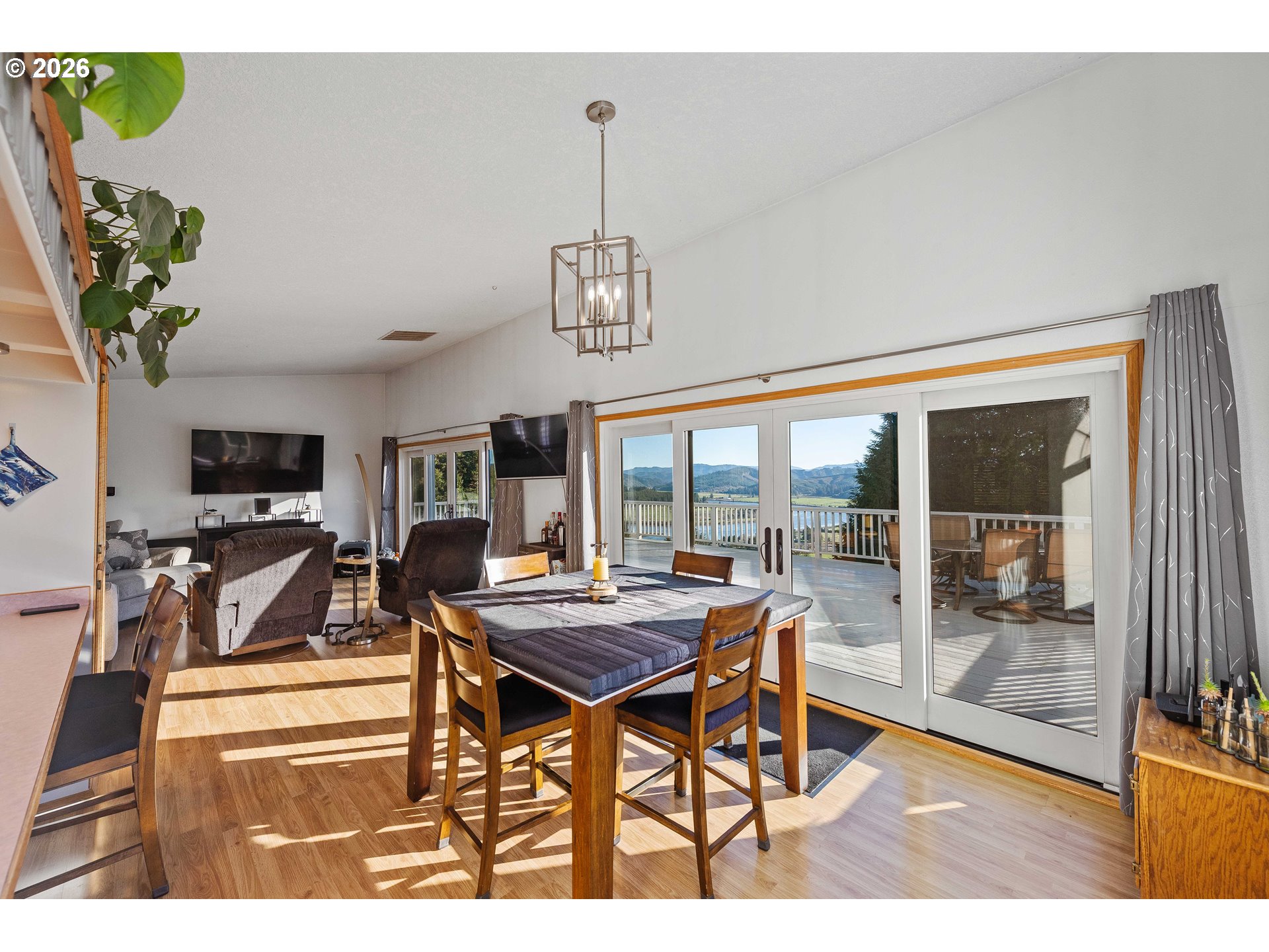 770 18th Avenue Coos Bay, OR 97420 - Photo 18 of 48 a dining room with furniture a chandelier and wooden floor