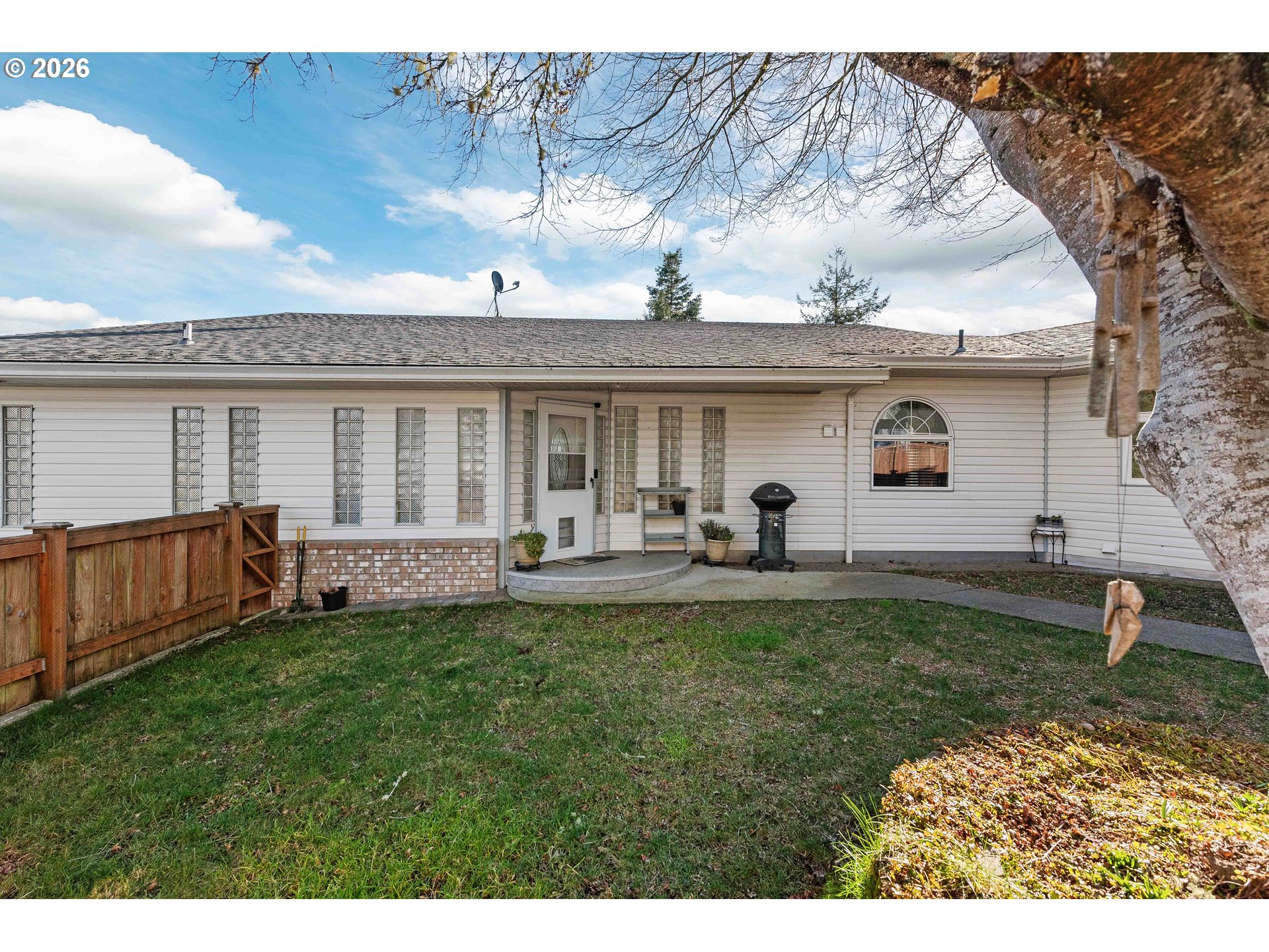 770 18th Avenue Coos Bay, OR 97420 - Photo 2 of 48 a front view of a house with a garden