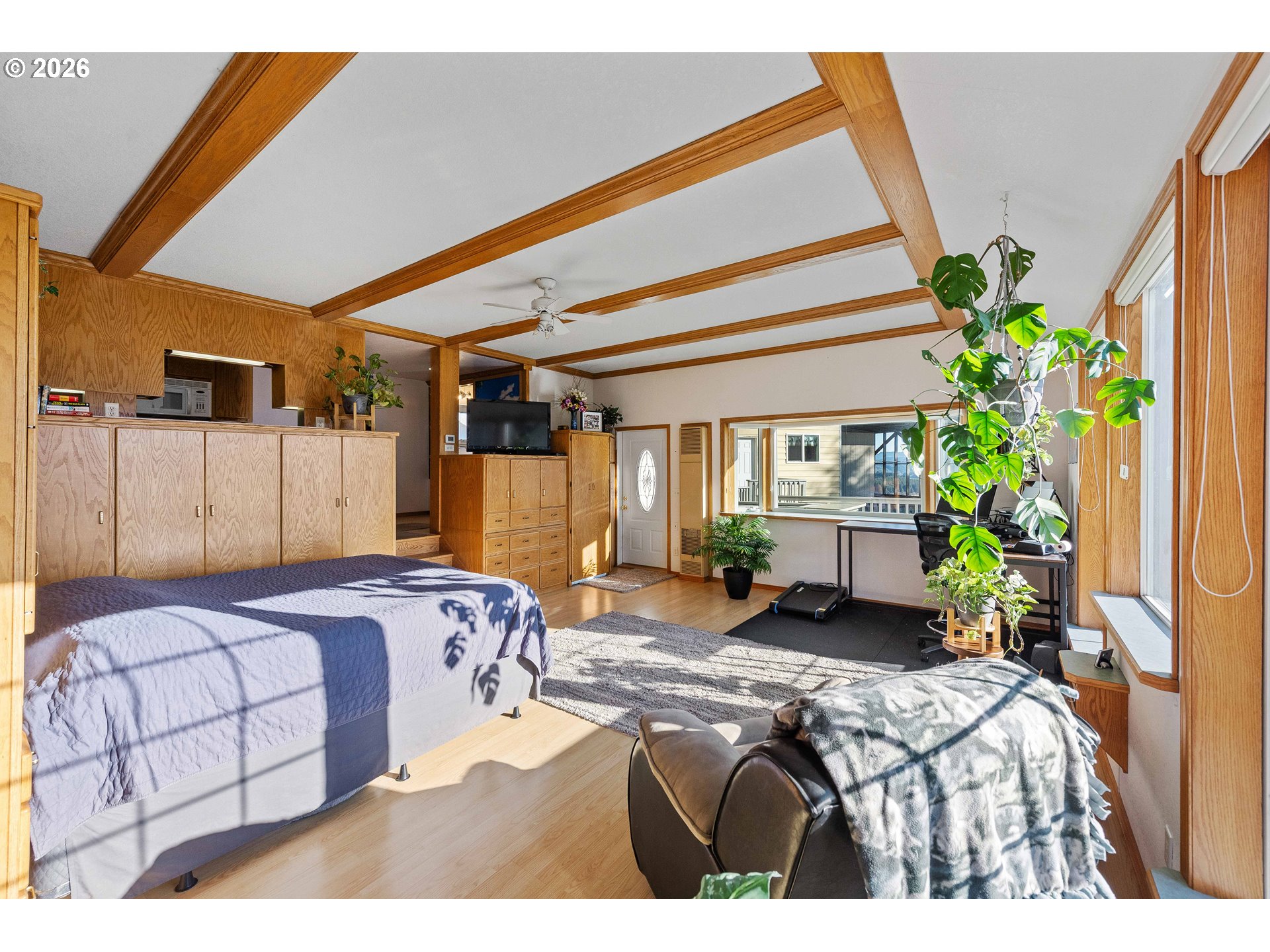 770 18th Avenue Coos Bay, OR 97420 - Photo 26 of 48 a bedroom with a bed table and a potted plant