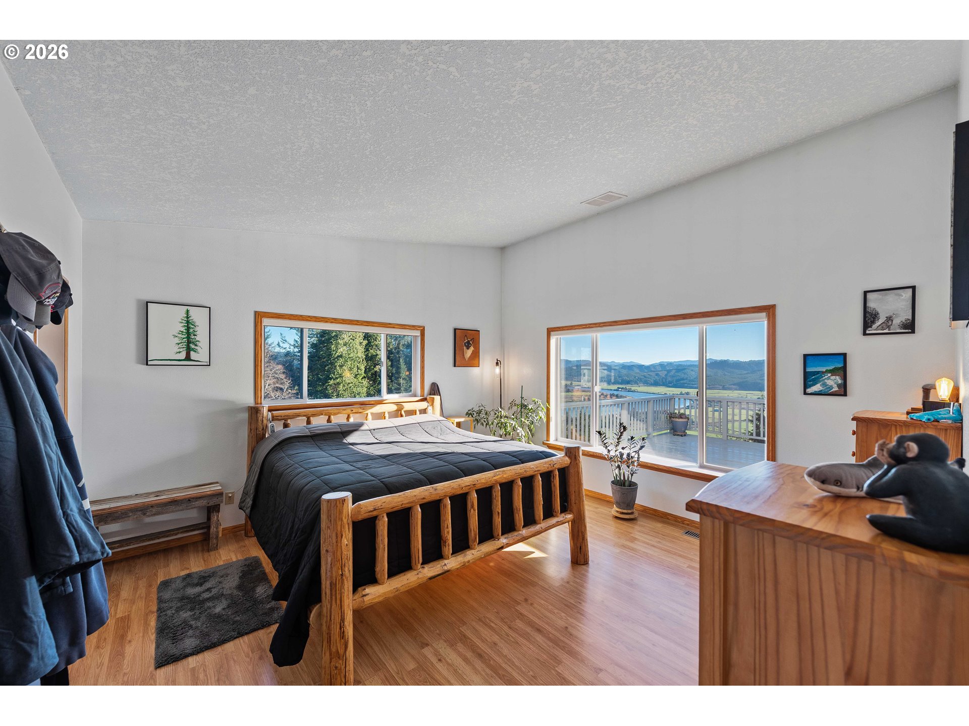 770 18th Avenue Coos Bay, OR 97420 - Photo 3 of 48 a bedroom with furniture and a large window