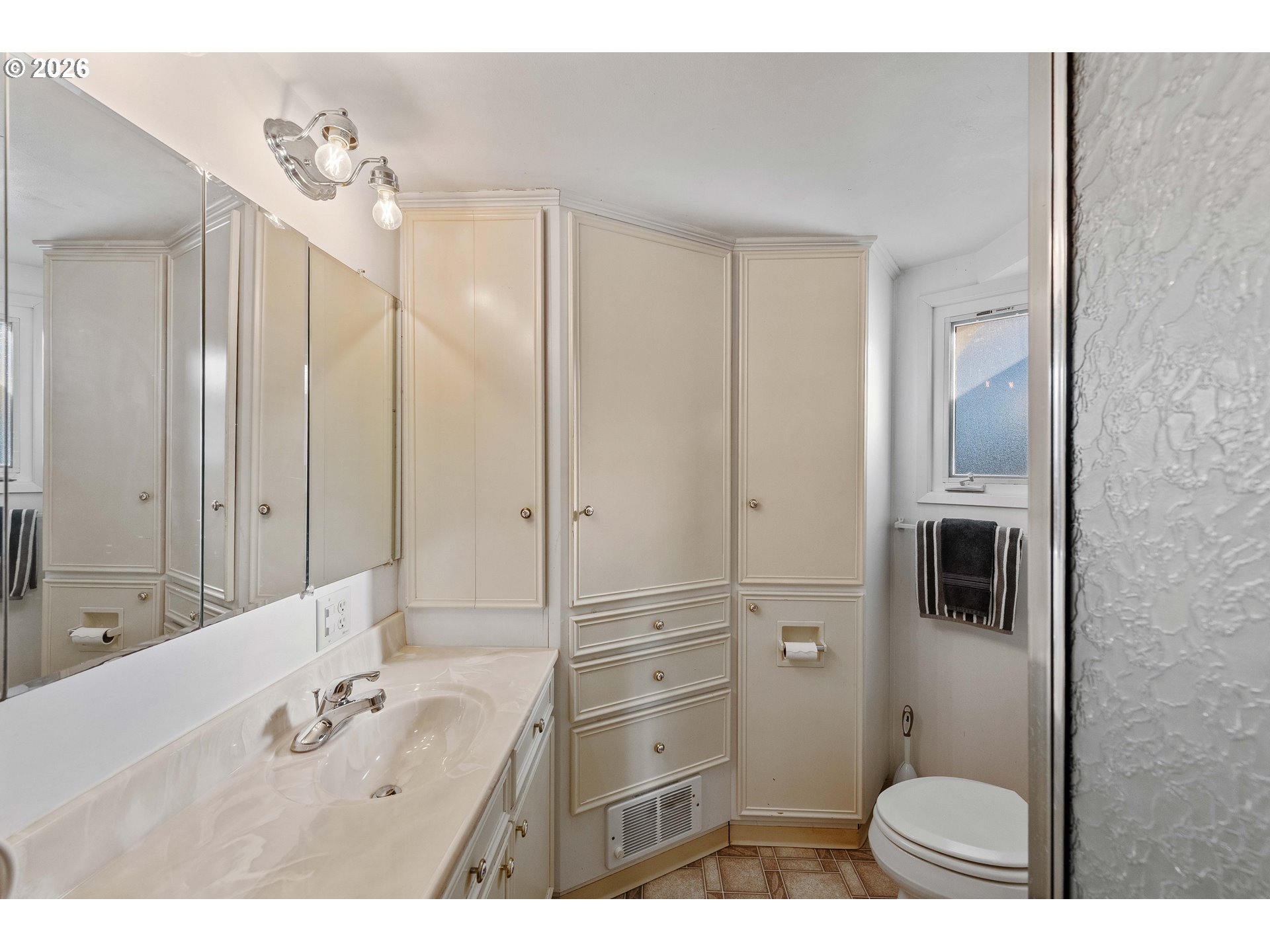770 18th Avenue Coos Bay, OR 97420 - Photo 33 of 48 a bathroom with a tub a sink a mirror and a shower