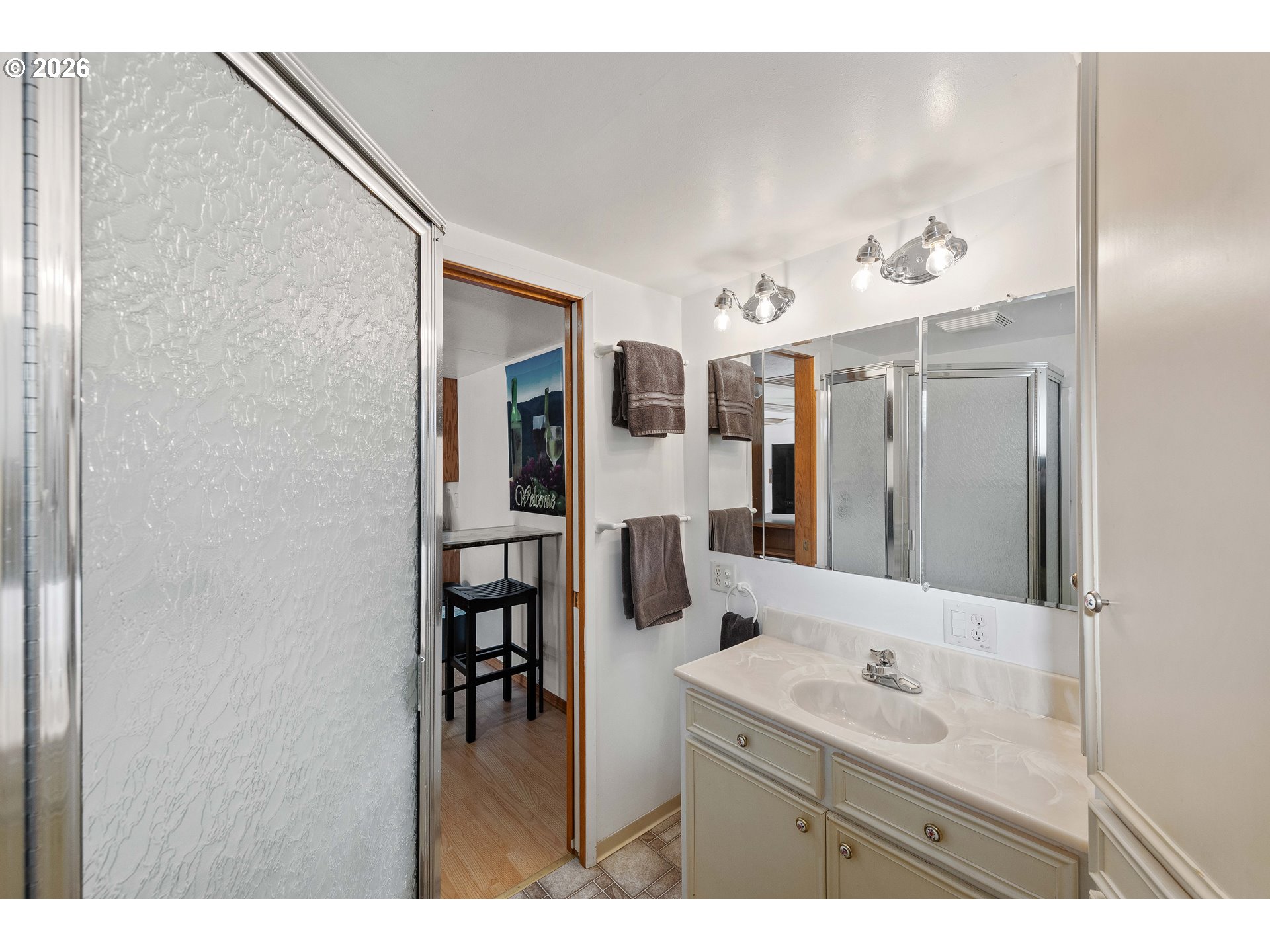 770 18th Avenue Coos Bay, OR 97420 - Photo 34 of 48 a bathroom with a double vanity sink and mirror