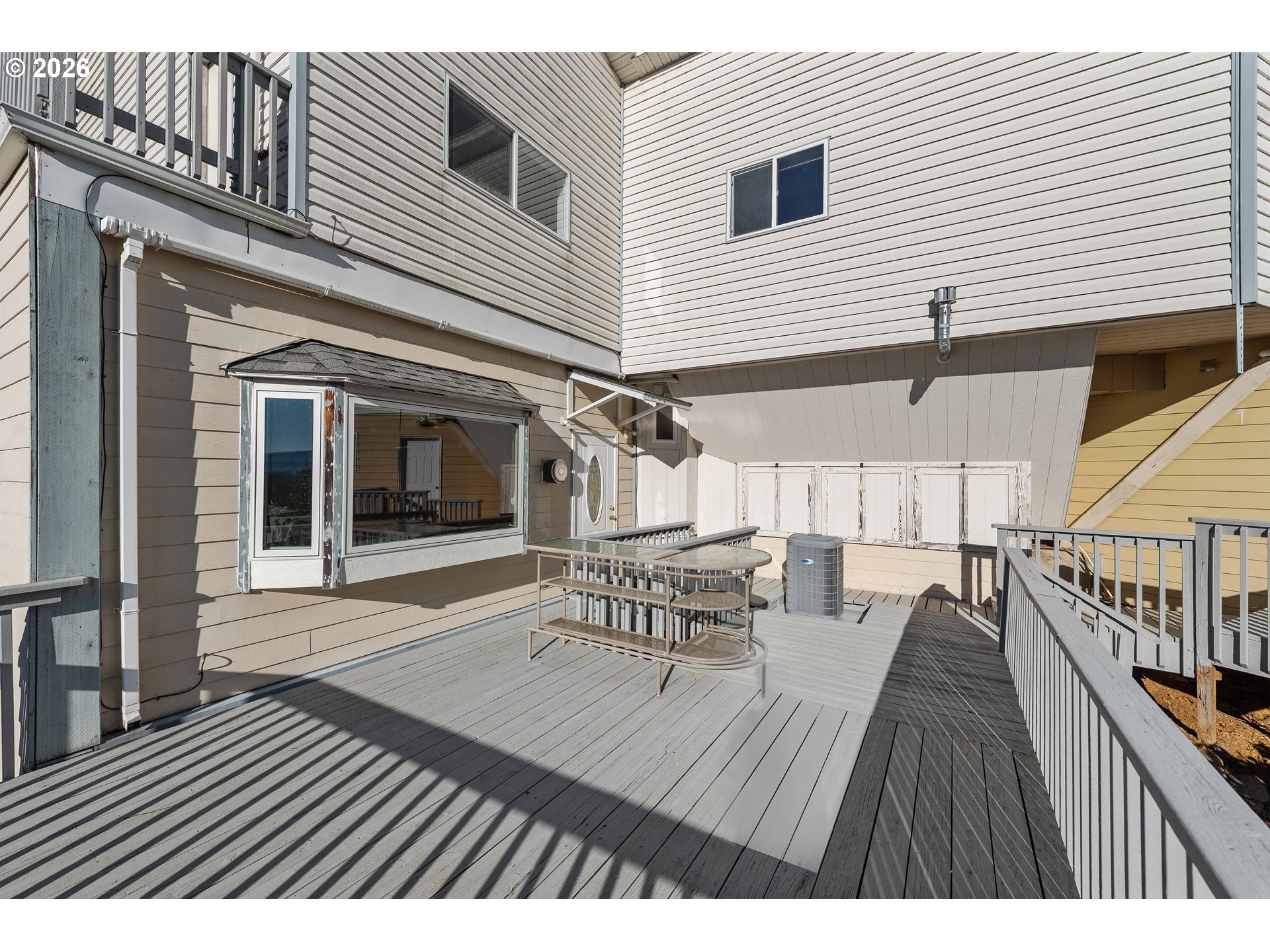 770 18th Avenue Coos Bay, OR 97420 - Photo 38 of 48 a view of a house with a table and chairs