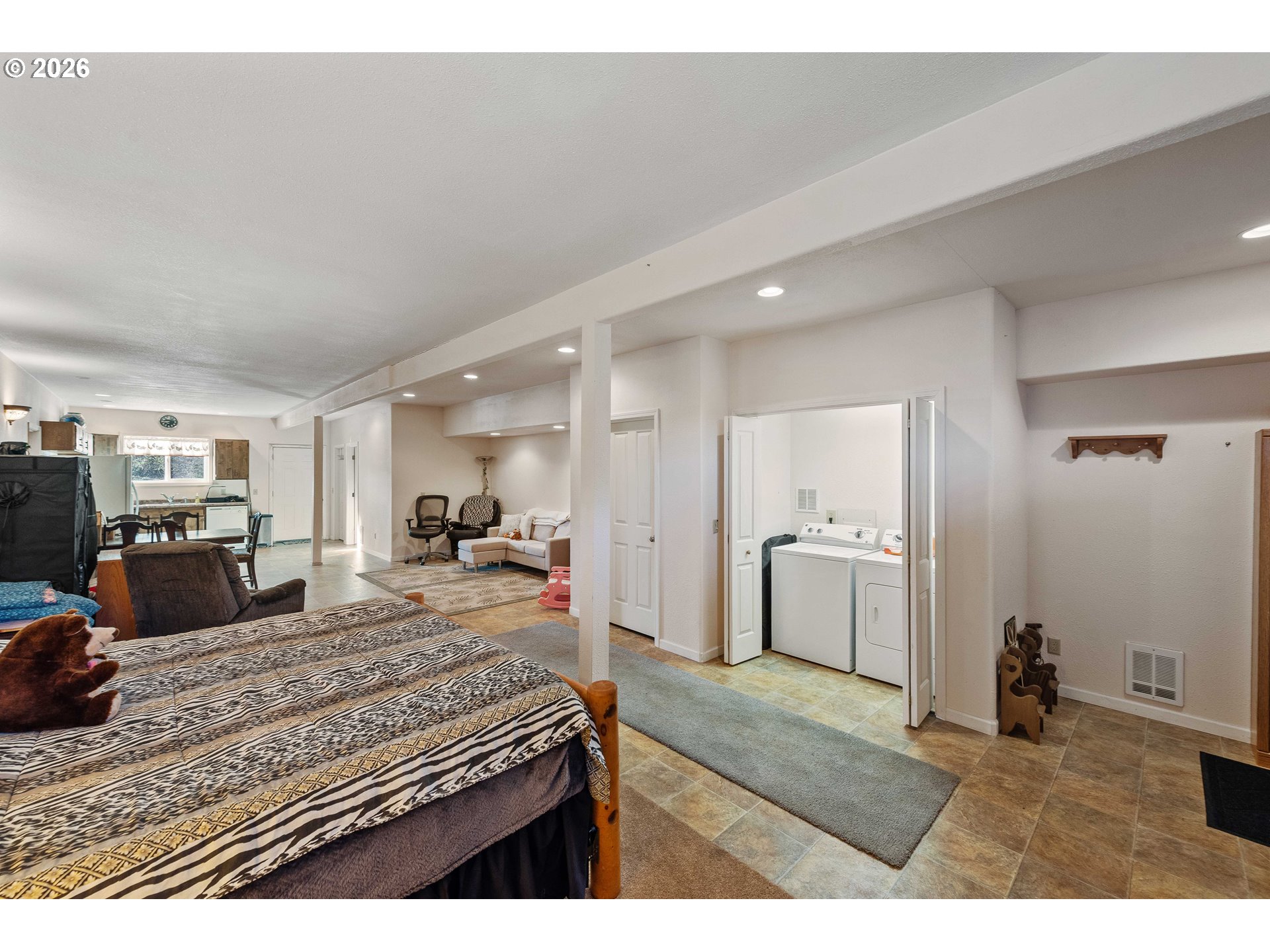770 18th Avenue Coos Bay, OR 97420 - Photo 42 of 48 a large bedroom with a bed and a view of living room