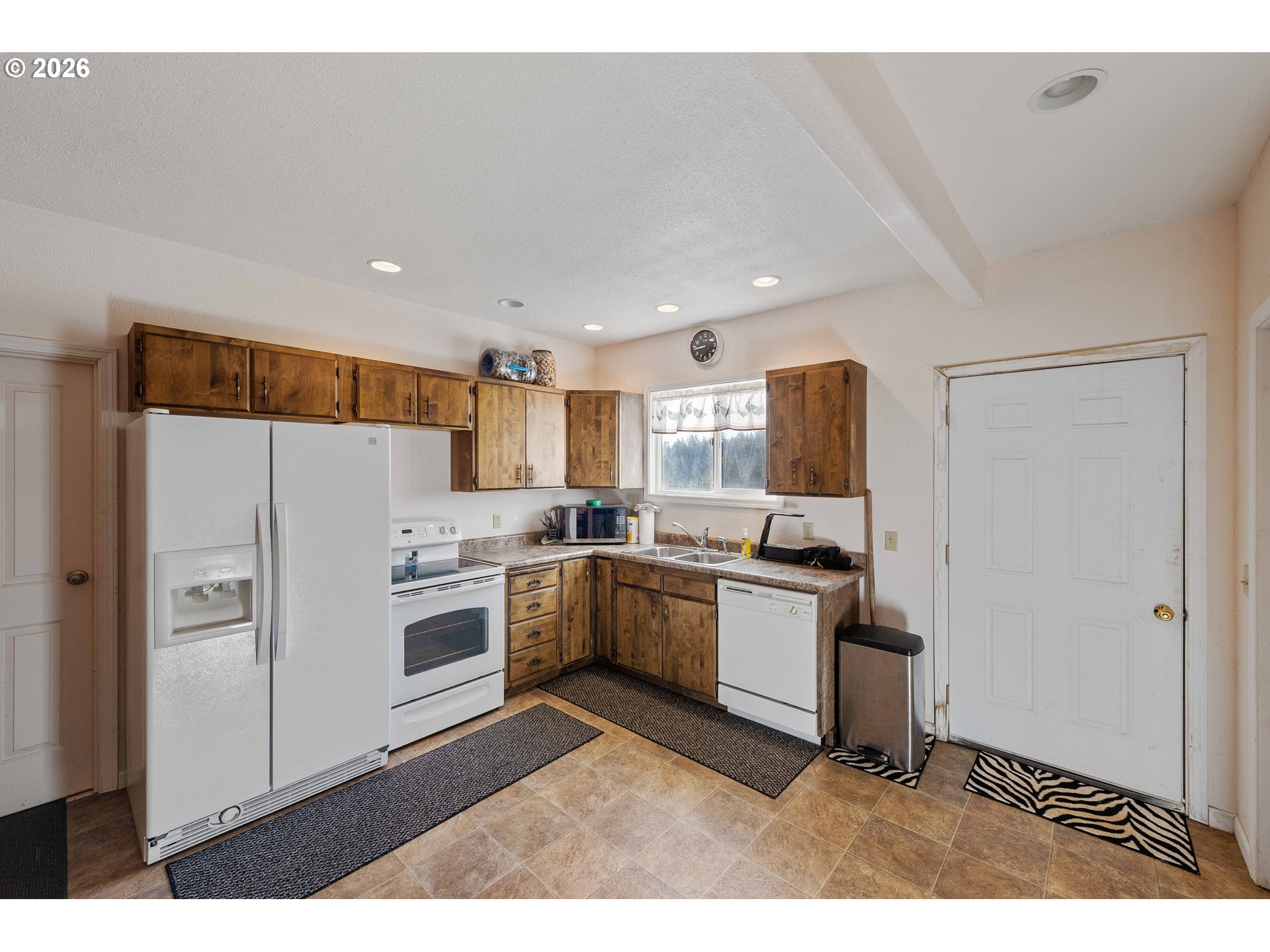770 18th Avenue Coos Bay, OR 97420 - Photo 44 of 48 a kitchen with a sink stainless steel appliances and cabinets