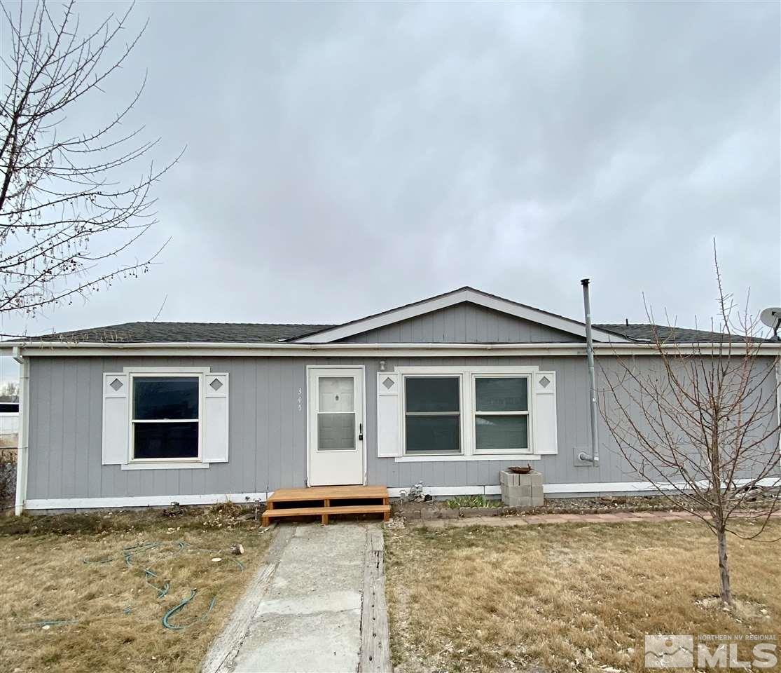 345 Reservoir Road Lovelock, NV 89419 - Photo 1 of 1 a front view of a house with a garden