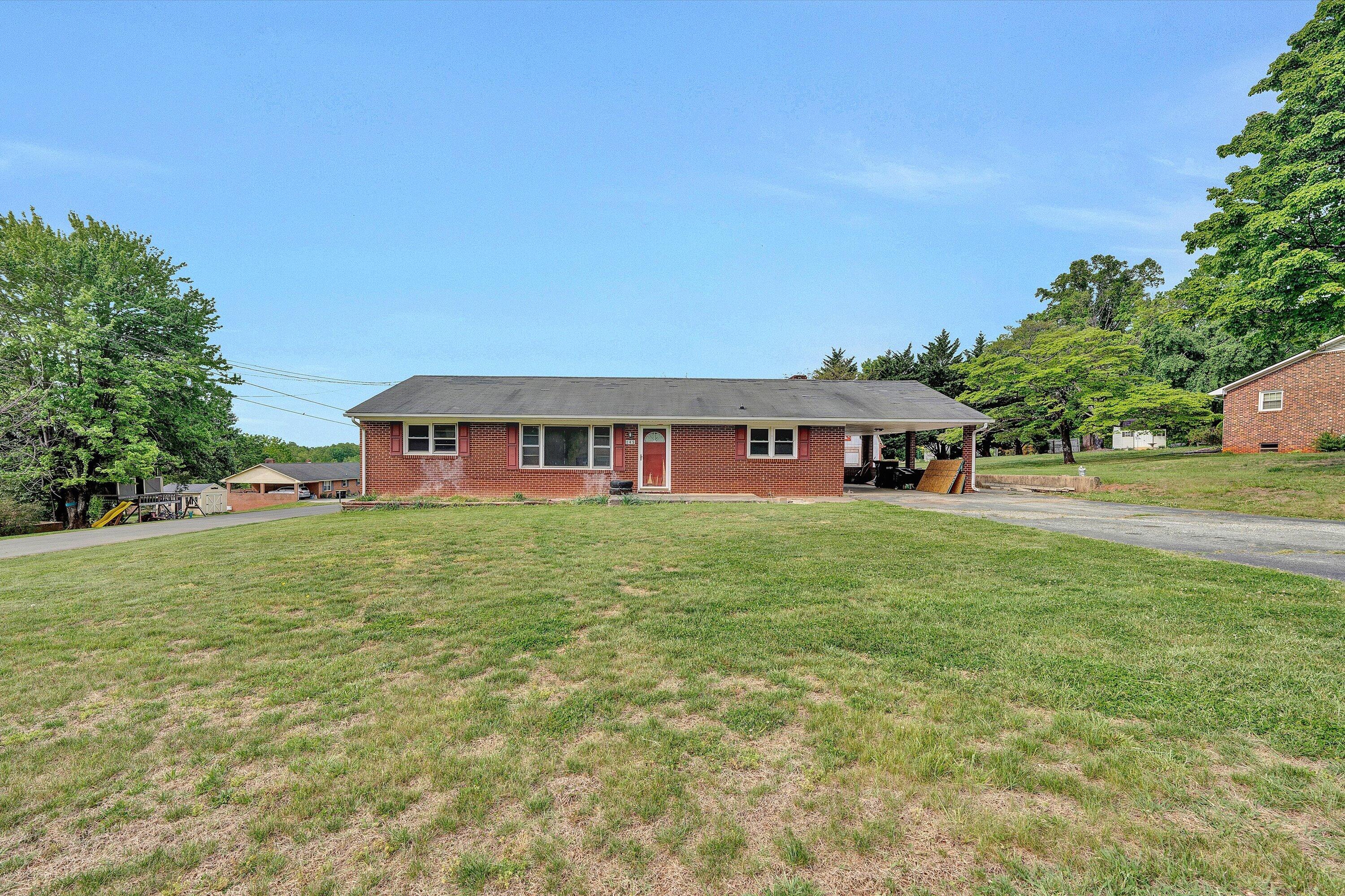 145 Cornell Road Rocky Mount, VA 24151 - Photo 2 of 16 a front view of a house with a yard