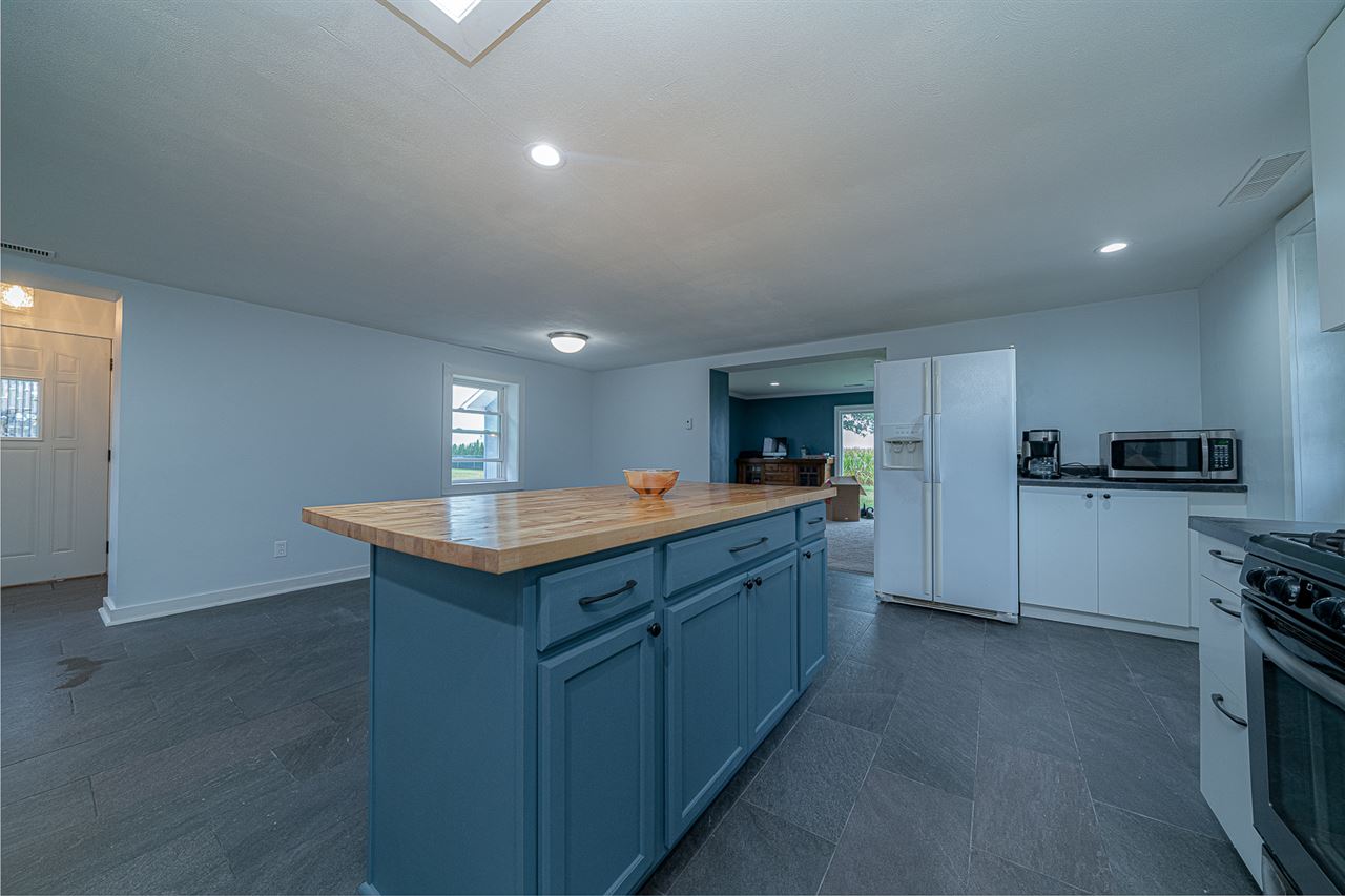 8424 South Main Street Rochelle, IL 61068 - Photo 11 of 26 a kitchen with granite countertop a sink and cabinets